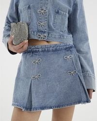 River Island - Skort Denim Diamante Bow Button Cotton - Lyst
