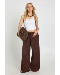 Boohoo - Petite Broderie Low Rise Wide Leg Trouser - Lyst