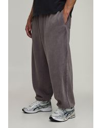 BoohooMAN - Baggy Fit Exposed Seam Washed Toggle Hem Jogger - Lyst