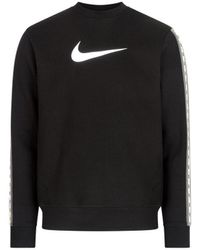 nike repeat pack logo taping polyknit tracksuit in black