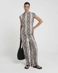 River Island - Snake Print Wide Leg Trousers - Lyst
