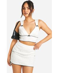 Boohoo - Textured Bow Detail Mini Skirt - Lyst