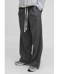 BoohooMAN - Elasticated Waist Wide Leg Wool Look Pleated Trousers - Lyst