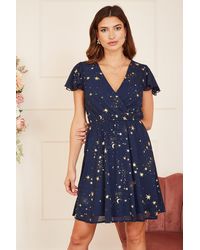 Mela London - Foil Star Print Wrap Skater Dress - Lyst