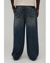 BoohooMAN - Gothic Applique Baggy Fit Jeans - Lyst