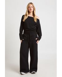 Boohoo - Petite Cinched Waist Off Shoulder Straight Leg Tracksuit - Lyst