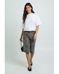 Boohoo - Longline Mid Rise Denim Jort - Lyst