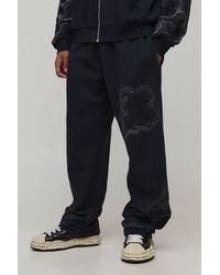 BoohooMAN - Baggy Fit Applique Washed Joggers - Lyst