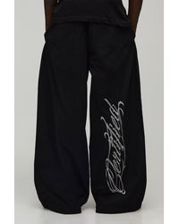 BoohooMAN - Extreme Parachute Fit Certified Embroidered Trousers - Lyst
