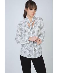 Conquista - Long Sleeve Floral Top With Neck Tie Detail And Button Cuffs By Fashion - Lyst
