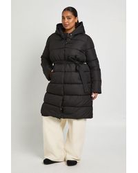Boohoo - Plus Belted Longline Puffer Jacket - Lyst