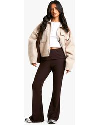Boohoo - Petite Fold Over Waistband Soft Rib Flare Trouser - Lyst