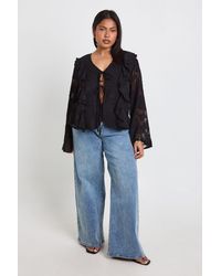 Boohoo - Plus Burnout Ruffle Front Tie Blouse - Lyst
