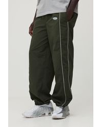 BoohooMAN - Relaxed Fit Elasticated Front Binding Toggle Hem Nylon Trousers - Lyst