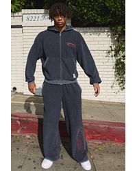 BoohooMAN - Wide Leg Reverse Distressed Woven Tab Joggers - Lyst