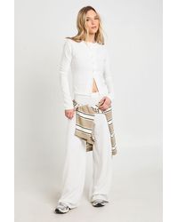 Boohoo - Petite Rib Button Through Long Sleeve Top And Wide Leg Trouser Co-Ord - Lyst