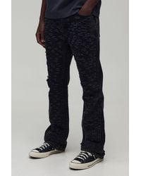 BoohooMAN - All Over Ripped Stacked Gusset Slim Flared Jeans - Lyst