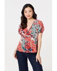 Izabel London - Ditsy Floral Faux Wrap V-Neck Top Short Sleeve - Lyst