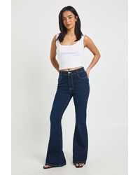 Boohoo - Petite High Waist Booty Lifting Flared Jean - Lyst