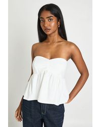 Boohoo - Ruched Bust Peplum Bandeau Top - Lyst