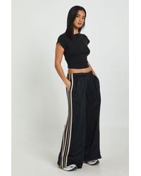 Boohoo - Petite Side Stripe Adjustable Cuff Wide Leg Jogger - Lyst