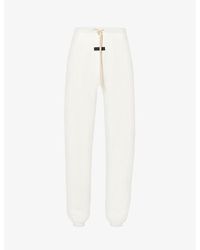 Fear Of God - Essentials Brand-print Relaxed-fit Cotton-blend jogging Bottoms - Lyst