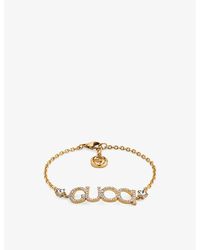Gucci - Logo-script Embellished Antique Gold-toned Metal Bracelet - Lyst