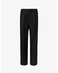Gucci - Monogram-pattern Pleated Mid-rise Wool Trousers - Lyst