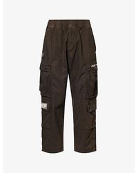 Aape - Tapered-leg Mid-rise Cotton-blend Trousers - Lyst