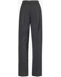 Victoria Beckham - Pleated Tapered-leg Mid-rise Stretch-woven Trousers - Lyst