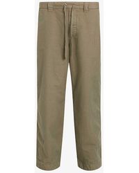 AllSaints - Buck Tapered-leg Relaxed-fit Organic-cotton Trousers - Lyst