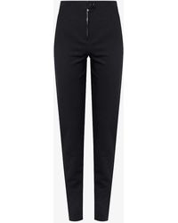 Alaïa - Tapered-leg High-rise Stretch-woven Trousers - Lyst