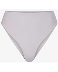 Skims - Signature Swim Mid-rise Stretch Recycled-nylon Bikini Bottom - Lyst
