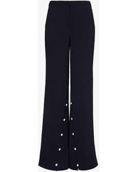 Stine Goya - Button-embellished Wide-leg Recycled-polyester Woven Trousers - Lyst