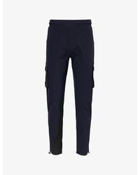 Arne - Tapered-Leg Mid-Rise Stretch-Woven Trousers - Lyst