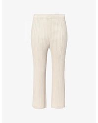 Pleats Please Issey Miyake - Pleated Mid-rise Flared-leg Knitted Trousers - Lyst