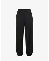 Jil Sander - Elasticated-waistband Tapered-leg Mid-rise Stretch-woven Trousers - Lyst