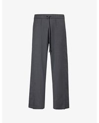 NAHMIAS - Brand-patch Drawstring-waistband Relaxed-fit Wide-leg Wool Trousers - Lyst