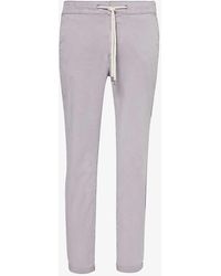 PAIGE - Fraser Tapered-leg Stretch-woven Trousers - Lyst