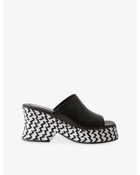 Claudie Pierlot - Two-Tone Braided Raffia-Leather Mules - Lyst