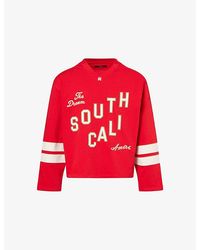 Amiri - South Cali Flock Cotton-Jersey Football T-Shirt - Lyst