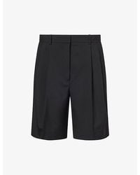 KHAITE - Auggie Pleated Wool Shorts - Lyst