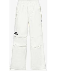 Aape - Logo-embroidered Wide-leg Cotton-blend Woven Trousers - Lyst
