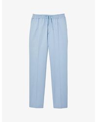 Sandro - Tapered Drawstring-waist Stretch-cotton Blend Trousers - Lyst