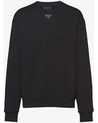 Prada - Logo-plaque Crewneck Relaxed-fit Cotton-jersey Sweatshirt - Lyst