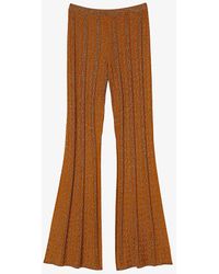Sandro - Flared-leg High-rise Metallic Stretch-knit Trousers - Lyst
