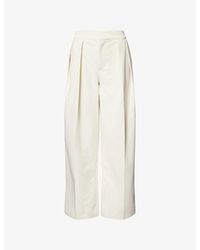 The Couture Club - Wide-Leg Pleated Woven Trousers - Lyst