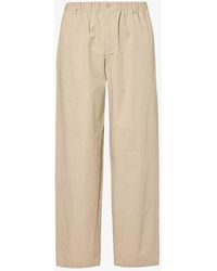 Gucci - Brand-embroidered Tapered-leg Relaxed-fit Cotton Trousers - Lyst