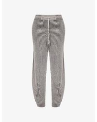 Stel - Ribbed Tapered-Leg Wool-Blend Knitted Trousers - Lyst