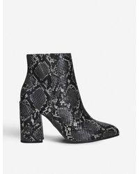 snakeskin boots flat